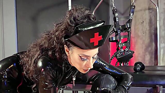 TANGENTOD Nurse Dominates Hooded Latex Sub