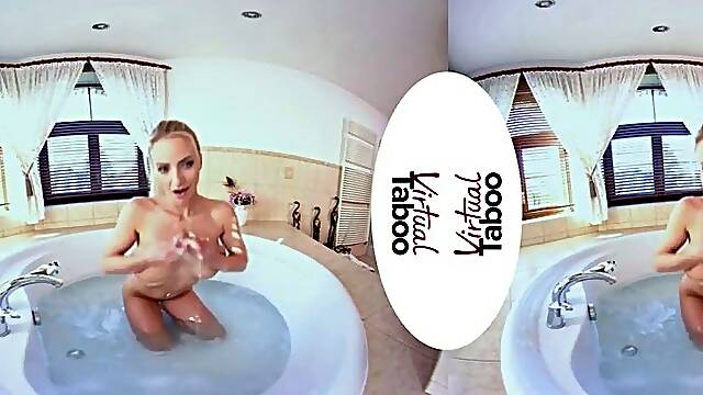 POV of a blondie mummy tugging in bath