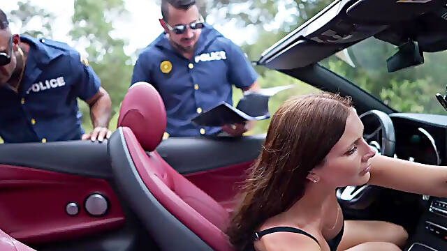 Steamy brunette pleases two police officers cocksk outdoors to get free