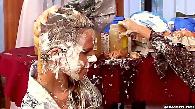 Two lesbians engage in a wild food fight