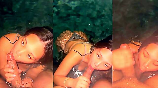 Asian babe gives sloppy blowjob in the swimming pool.