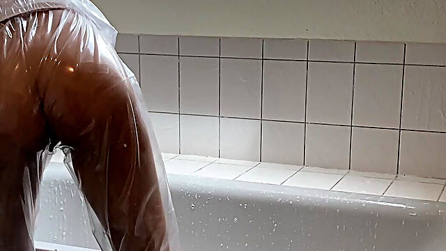 Sue, Cleaning the Bathroom in a Pvc Suit!